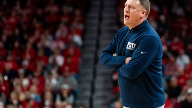 Penn State men's basketball coach Mike Rhoades guides his team against Nebraska in a Big Ten Conference game.